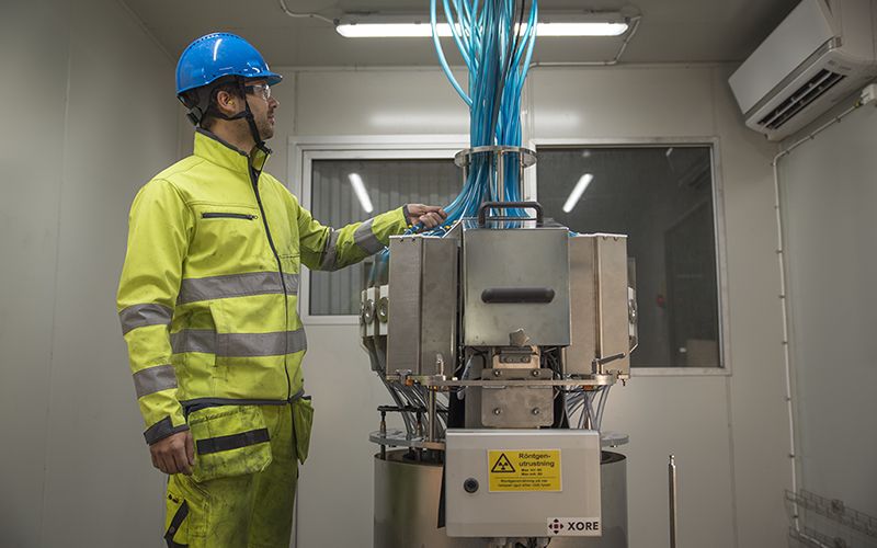 A service engineer performing maintenance on a Boxray on stream XRF analyzer. Boxray 24.